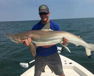 Captain Steve Mullen Holding a Shark | Family-Friendly Fishing Charters in Jacksonville, FL - Fish Hunter Charters
