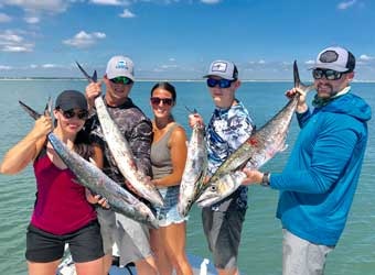 A Family with Their Caught Fish | Family-Friendly Fishing Charters in Jacksonville, FL - Fish Hunter Charters