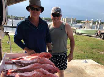 Steve Mullen and Man Showing Caught Fish