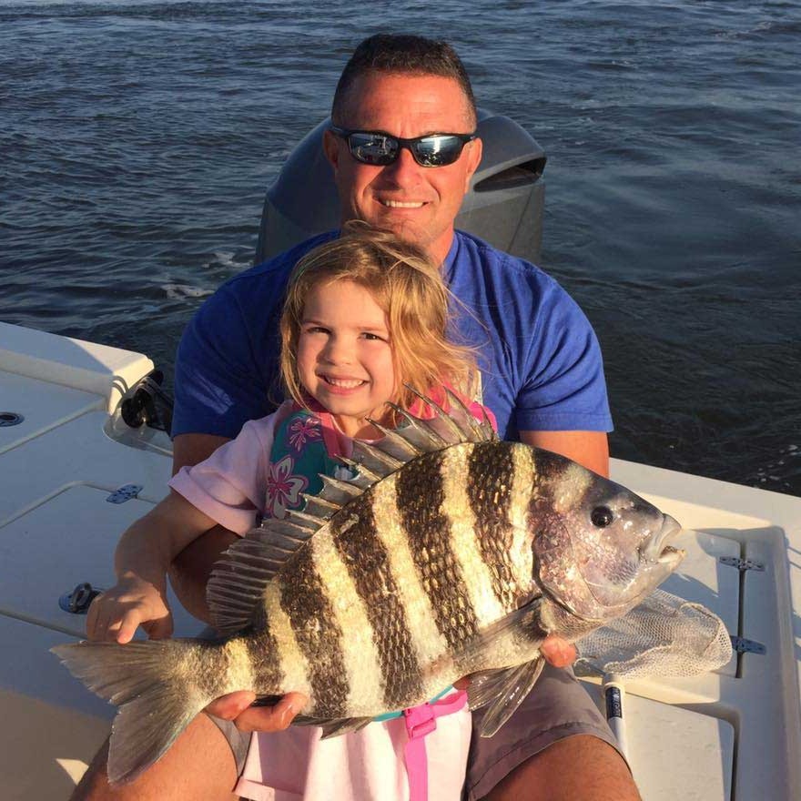 Father and Daughter With a Fish | Saltwater Fishing in Jacksonville, FL - Fish Hunter Charters